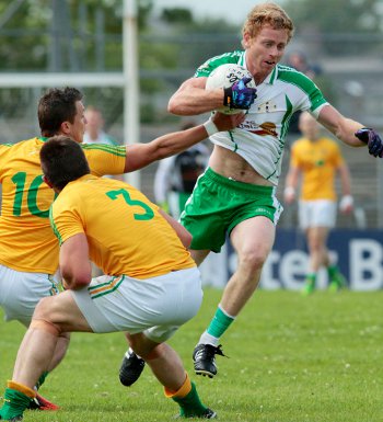 Damien Dunleavy escapes Leitrim's Paul Brennan and Ciaran Egan at Dr. Hyde Park on June 30 in the Connacht Semi-Final Replay