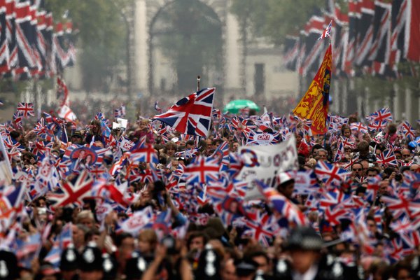 Well wishers wave flags following the royal wedding in 2012 