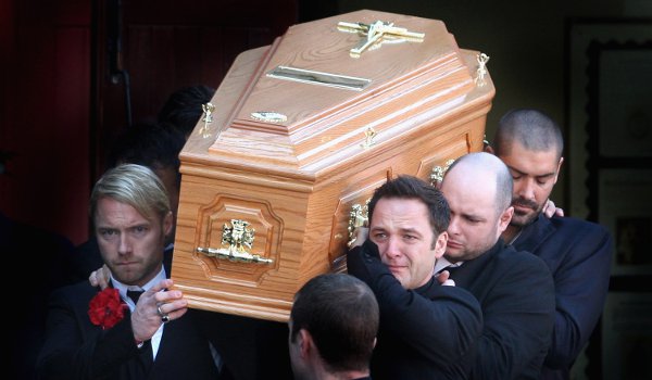 Members of Boyzone carry Stephen Gately's coffin at his funeral in 2009