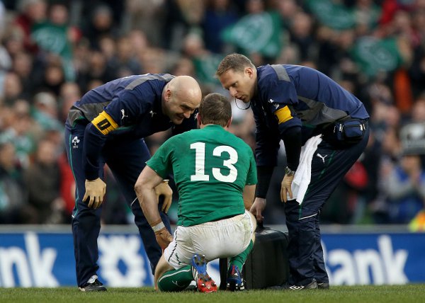 Brian O'Driscoll is assessed by Ireland's medical team during the clash with New Zealand. ©INPHO/Ryan Byrne
