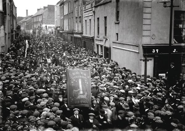 Crowds applaud as striking workers march through Wickham St onto William St, Limerick, in April 1919 during the general worker’s strike.  Taken from Franz S. Haselbeck's Ireland - Selected Photographs compiled by Patricia Haselbeck Flynn, published by The Collins Press, 2013