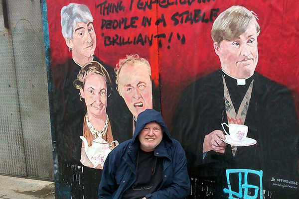 Painter John Bulley with his work