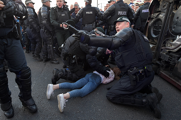 PSNI officers attend to the girl after lifting the car off her (Getty Images)