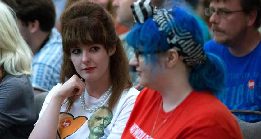 SOUTHAMPTON, ENGLAND - AUGUST 25:  Supporters of Labour leadership candidate Jeremy Corbyn wait for him to speak at a rally for his supporters at the Hilton at the Ageas Bowl on August 25, 2015 in Southampton, England. Jeremy Corbyn remains the bookies' favourite to win the Labour leadership contest which will be announced on September 12 after the ballots close on September 10  (Photo by Matt Cardy/Getty Images)