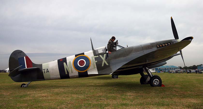 A pilot climbs into a Spitfire to mark 75 years since the Battle of Britain's "Hardest Day" when bases came under attack from the German Luftwaffe. (Photo by Carl Court/Getty Images)