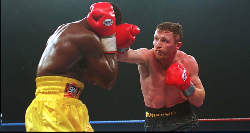 Collins lands a right on Chris Eubank in Millstreet, Ireland. [Mandatory Credit: Steve Munday/ALLSPORT]