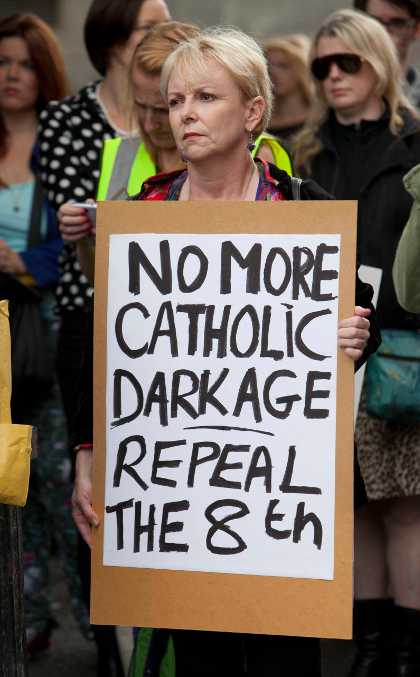 File Photo Taoiseach Enda Kenny said that Fine Gael will not commit to holding a referendum to repeal the Eighth Amendment of the Constitution, if returned to government, without considering what would replace it. 23/8/2014. Pro Choice Protest Dublin. Members of the public at a rally in favour of repealing the 8th Amendment to the Irish Constitution in favour of a more liberal law on a womans right to abortion facilities in Ireland. They are carrying a banner saying " No more catholic darkage repeal the 8th". This demonstration is over a young woman who was raped and felt sucidal and wanted an abortion but was refused. Photo Eamonn Farrell/RollingNews.ie