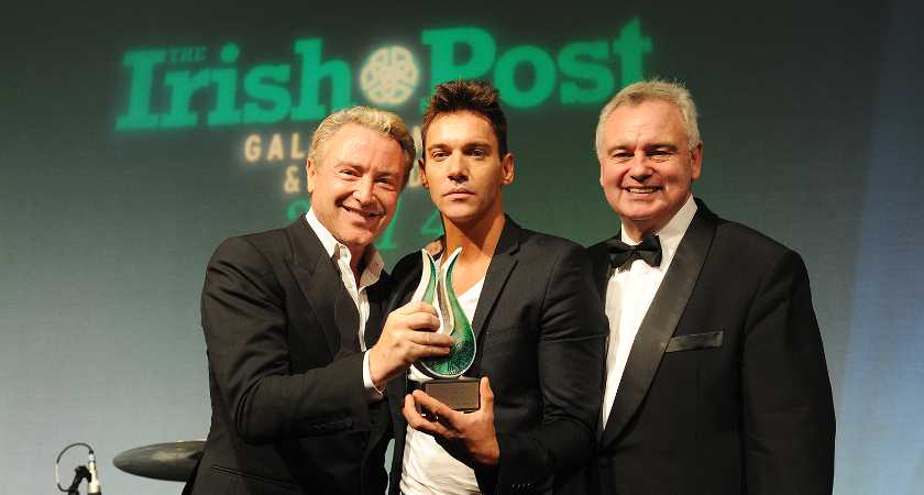 Jonathan Rhys Meyers and Mara Lane The Irish Post Awards 2014 and Business Gala Dinner held at the London Hilton, Park Lane on Thursday, October 23rd 2014. Award-winners: Actor Jonathan Rhys Meyers, Football legend Liam Brady, Designer Louise Kennedy, Sean Mulryan, Sir David McMurtry, Michael Forde Guests included: Michael Flatley, Eamonn Holmes, Mara Lane, Paul Costelloe, David Forde, Liam O’Neill, Niall O’Dowd, Dr Leah Totton, Charlotte Jaconelli. Celebrities, stars and business personalities were honoured at this year’s Irish Post Awards which took place on Thursday, October 23rd. The Irish Post Awards 2014 and Business Gala Dinner celebrated the success of six individuals across a variety of industries. This year’s Awards were attended by 700 guests. Hosted by broadcaster Eamon Holmes, the black tie event honoured a number of exceptional people including actor Jonathan Rhys Meyers, who received this year’s Legend award for his contribution to the film and entertainment industry. Also honoured on the night with an award for Outstanding Contribution to Business in Britain was Sean Mulryan, Chairman and Group Managing Director of Ballymore – an international property investment and development company. This year’s Technology Award, a new addition to The Irish Post’s series of accolades, went to Sir David McMurtry, Chairman of Renishaw Plc. Designer Louise Kennedy, who celebrated 30 years in business in 2013, picked up a special award for Company of the Year. The Outstanding Sports Personality Award went to Ireland and Arsenal footballing legend Liam Brady. A special Community Award was also given out on the night to Michael Forde, Chairman of the Irish World Heritage Centre in Manchester. Owner and Publisher of The Irish Post, Mr Elgin Loane, said: “2014 has been a truly historic year for the Irish in Britain; from the ever strengthening economic and trade relations to the significant first ever state visit of President Higgins in April. It is with all this in mind that we are more excited than ever about this year’s Irish Post Awards ceremony. The Irish Post is delighted to once again have the opportunity to recognise and honour the achievements of a group of remarkable people in the Irish community spanning the fields of entertainment, technology, property, sport, design and community. Each of our recipients shares a resolute desire to succeed along with an enterprising spirit and a passion for Ireland and this is embodied in our award categories.” Two charities will benefit from this year’s Awards night, with proceeds from the night’s exclusive raffle going to Barretstown and Mind Yourself