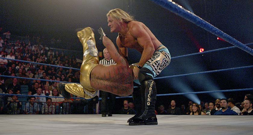 LAS VEGAS - DECEMBER 2:  (U.S. TABLOIDS OUT)   WWE wrestlers Rey Mysterio (in gold) and Chris Jericho perform on stage during the "1st Annual Video Game Awards" at the MGM Grand Garden Arena December 2, 2003 in Las Vegas, Nevada.  The show premieres on Spike T.V. Thursday, December 4 at 9:00PM ET/PT.  (Photo by Frank Micelotta/Getty Images)