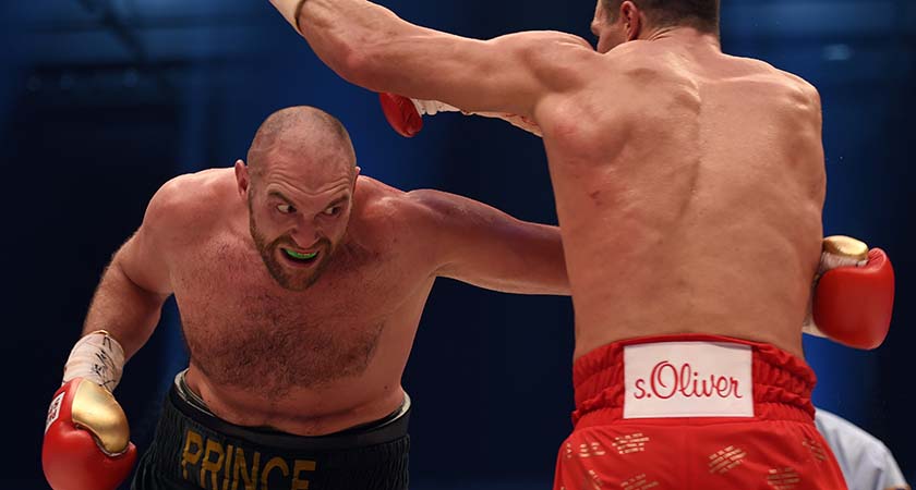World heavyweight boxing champion Wladimir Klitschko (R) of Ukraine defends against Britain's Tyson Fury during their WBA, IBF, WBO and IBO title bout in Duesseldorf, western Germany, on November 28, 2015. Fury dethroned Klitschko in a 12round decision to become world heavyweight champion. AFP PHOTO / PATRIK STOLLARZ / AFP / PATRIK STOLLARZ (Photo credit should read PATRIK STOLLARZ/AFP/Getty Images)