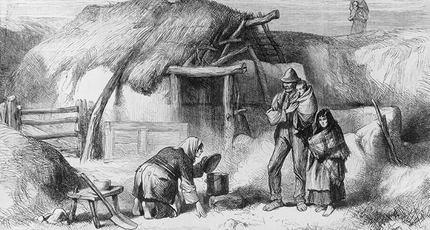 13th December 1879: A barefoot family outside a ' bog trotter's' cabin in Roscommon, Eire. Food is cooking on a fire in the yard beside a roughly thatched shack. Original Publication: Illustrated London News - Irish Sketches - pub. 1879 (Photo by Hulton Archive/Getty Images)