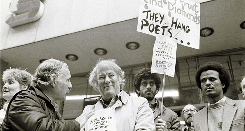 Irish Poet Seamus Heaney(3rd R) with Dunnes Stores Workers at a anti apartheid demo. 19/10/1985 Photo: Eamonn Farrell/RollingNews.ie