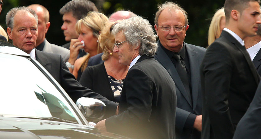 Don Maguire, centre, leaves following the funeral of his wife Ann Maguire at the Catholic Church of The Immaculate Heart of Mary on May 16, 2014 in Leeds, England. (Photo by Dave Thompson/Getty Images)