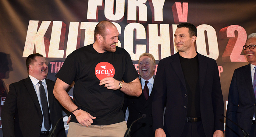 British heavyweight boxer Tyson Fury (L) poses alongside Ukrainian heavyweight Wladimir Klitschko, during a press conference to publicise their forthcoming world heavyweight title fight, at the Manchester Arena in Manchester, north-west England on April 27, 2016. Wladimir Klitschko has insisted he was "glad" to have lost his world heavyweight titles to Tyson Fury in December 2015, ahead of a re-match with the British boxer on July 9, 2016. With Klitschko's loss to Fury, the belts are now spread far and wide, with Fury holding the WBA and WBO titles, fellow Briton Anthony Joshua the IBF champion, and Deontay Wilder of the United States, the World Boxing Council's heavyweight title. / AFP / OLI SCARFF (Photo credit should read OLI SCARFF/AFP/Getty Images)