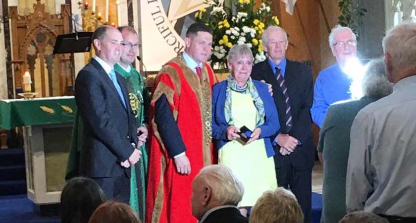 Betty Reilly nee Giggins receving her father Roy's medal