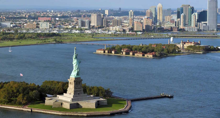 New York, New York, United States - October 13, 2009: An aerial view from a helicopter of the Statue of Liberty and Manhattan New York.
