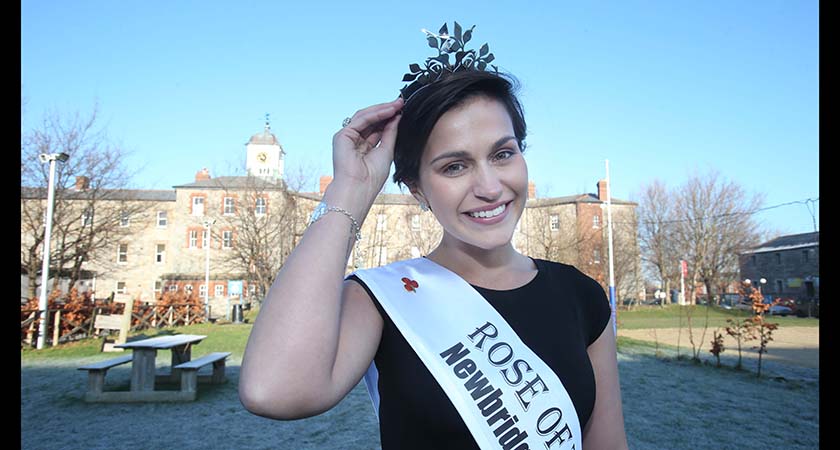 The first openly gay Rose was the 2014 Rose, Maria Walsh, pictured above at her alma mater, Griffith College Dublin. (Photo: Leon Farrell/Photocall Ireland.)