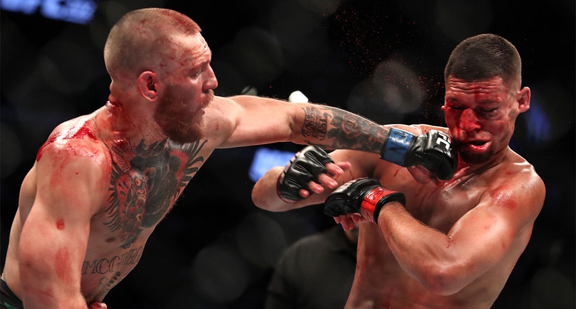 Diaz is bloodied as McGregor lands a left hook [Picture: Inpho]