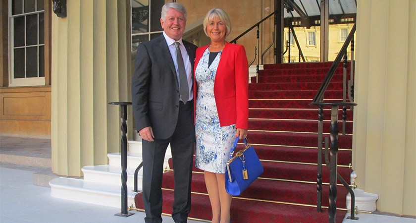 Mike and his wife at Buckingham Palace in July.