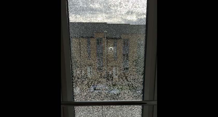 The shattered window in Mrs Mulvey's baby's room with a visible puncture. 