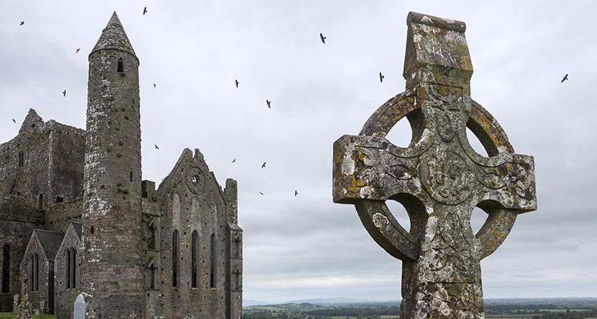 Cashel, Ireland - June 16, 2016: 'The Rock of Cashel', also known as 'Cashel of the Kings and St. Patrick's Rock', is a historic site near the village of Cashel in County Tipperary in the Republic of Ireland. The oldest and tallest of the buildings is the well preserved round tower (28 meters, or 90 feet), dating from circa 1100.