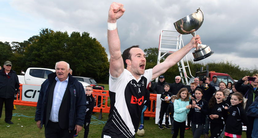 Captain Moyles raises the trophy in celebration [Picture: Mal McNally]
