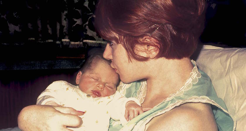 New mom kissing her newborn baby - original photographic slide form the seventies