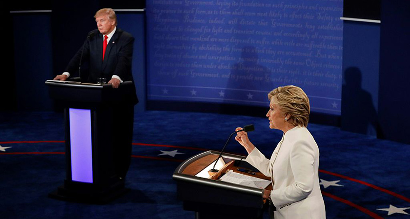 TOPSHOT - Democratic presidential nominee Hillary Clinton (R) speaks as Republican presidential nominee Donald Trump looks on during the final presidential debate at the Thomas & Mack Center on the campus of the University of Las Vegas in Las Vegas, Nevada on October 19, 2016. / AFP / Mark RALSTON (Photo credit should read MARK RALSTON/AFP/Getty Images)