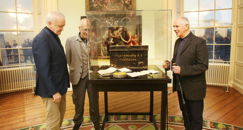 NO REPRO FEE 15/12/2016. Robert Maharry, Ruary O Siochain and Richard Gorman look at the chest they found almost 40yrs ago discovered in a skip on Fitzwilliam Square by the three friends out walking. How they came across the chest is noticed a pristine copy of a newspaper which had blown on to the ground on inspection they discovered it dated November 12th, 1921. What was in the chest was documents they came across bearing the name of Capt Edward Michael Conolly of the Royal Artillery and the address "Castletown". Papers in the box appeared to relate to land deals associated with Castletown, in Celbridge, and Leixlip Castle, also in Co Kildare, and other estates, but the men did not immediately investigate the contents fully. The chest remained in Mr Maharry garage in Dalkey, Co Dublin until last year, Artist Richard Gorman Last year was looking for a locations for a photo shoot and came across Castletown and made contact with Mary Heffernan of the Office of Public Works. After the photo shoot Mr Gorman got permission for a exhibition of his works there. Noticing the unusual spelling of the family name Conolly, Gorman recounted the tale of the chest to Ms Heffernan. The boxes were taken to the OPW this year and the officals were was astonished by the find. They are pictured in Dublin Castle at the formal handover to the State of the historic Castletown House Documentation. After conservation, the OPW will house the collection in Castletown where select documents will be available for public viewing. Photo: Leon Farrell/Photocall Ireland.
