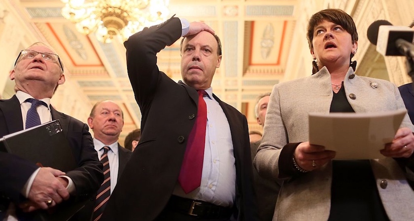 Deputy Leader of the Democratic Unionist Party, Nigel Dodds (C) gestures as Deputy Leader Democratic Unionist Party (DUP) leader Arlene Foster (R) speaks to members of the media in the Great Hall at Stormont before the start of the Assembly in Belfast, Northern Ireland on January 16, 2017. Northern Ireland appears headed for snap elections at a time when Britain will be moving to leave the European Union, with no sign of ending a bitter political impasse before a key deadline on Monday. Following fruitless negotiations seeking to break the deadlock that led to the resignation of deputy first minister Martin McGuinness of Sinn Fein last week, Northern Ireland secretary James Brokenshire signalled that elections appeared almost certain. / AFP / Paul FAITH (Photo credit should read PAUL FAITH/AFP/Getty Images)