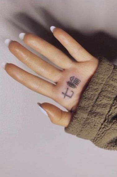 Ariana Grande tries and fails to correct mistranslated Japanese tattoo.